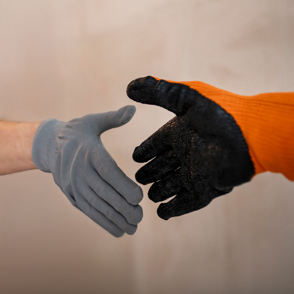 Mican plastering clients shaking hands.