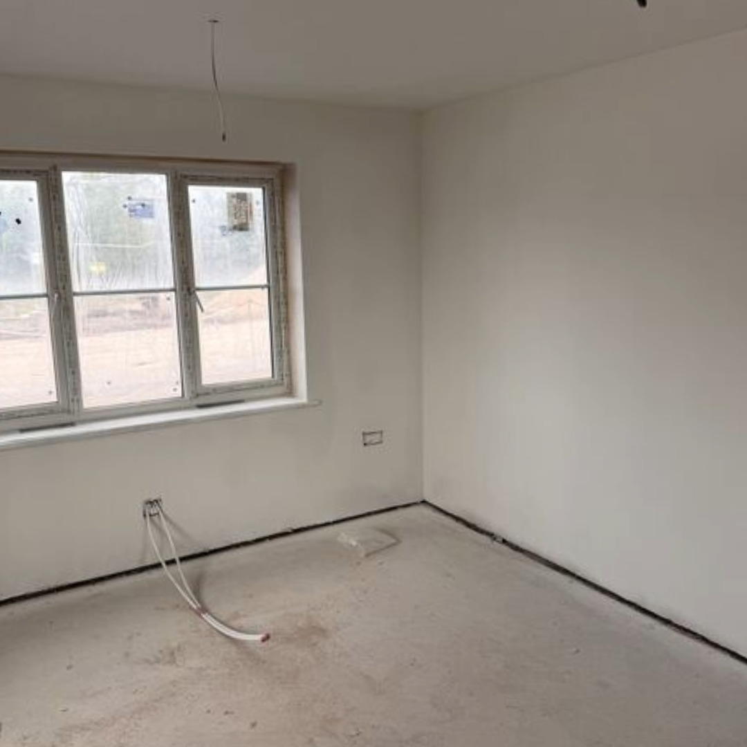 Completed dry lining plastering by Mican in a bedroom of a home at Moss Nook in St Helens, Merseyside.