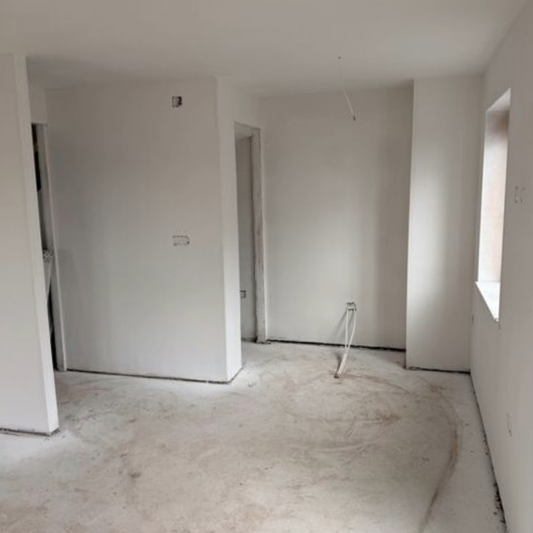 Completed dry lining plastering by Mican in the hallway of new build affordable house at Moss Nook in St Helens.